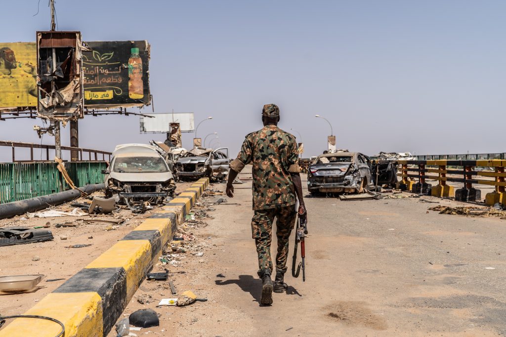 On the Shambat bridge that connects Omdurman with the Bahri neighborhood of Khartoum Omer Abd Alghader, aged 42, who is a Sudanese soldier who started his professional career fighting in Darfur during the 2002 war in the country's troubled west. In 2008, he became a military cameraman for the Sudanese Armed Forces. He was severely injured during a missile strike on an armored army vehicle on September 26, 2024, that killed three other colleagues with whom he was traveling. "I heard the whistling sound of the rocket and managed to jump out before it hit." He spent two months in a military hospital and now acts as SAF media liaison for national and international journalists covering the war.